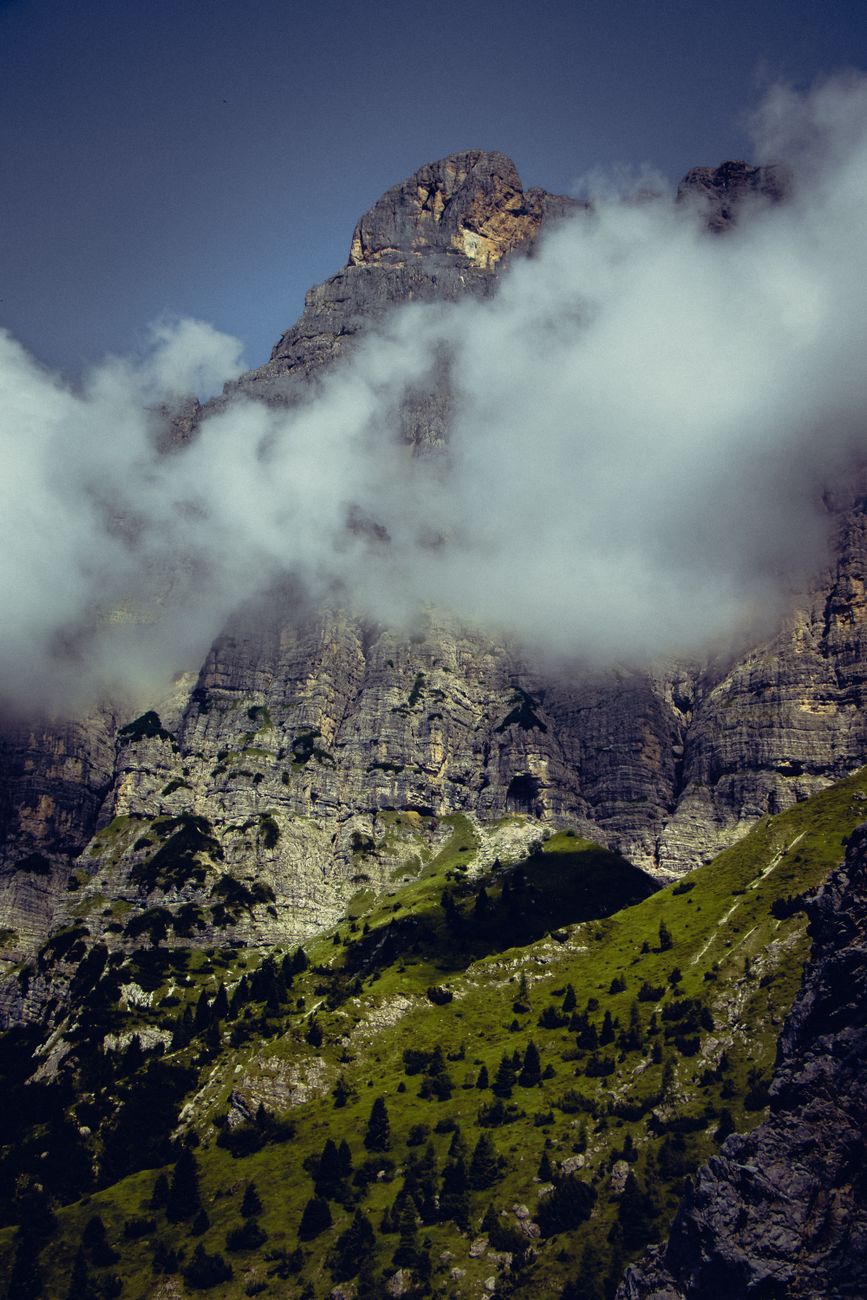 Panoramic view of rugged Dolomites peaks with golden afternoon sun